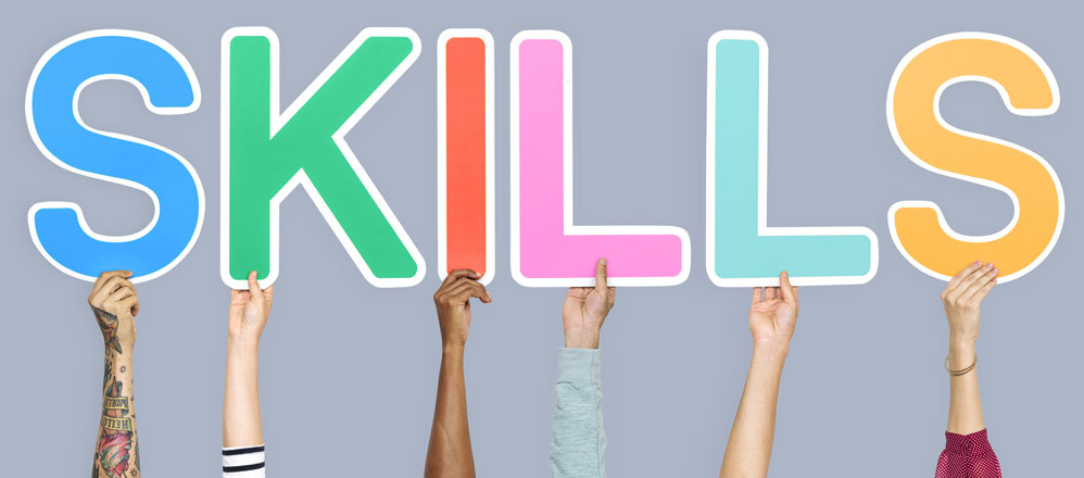 Hands holding the word skills image