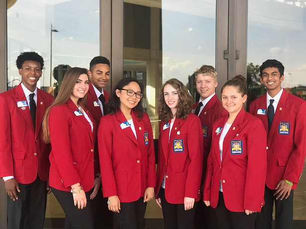 4 teenage girls and 4 teenage boys in matching blazers