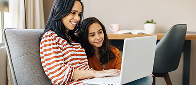 Parent and student looking at computer