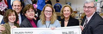 Milken Family Foundation Trustee Lori Milken (left) and Milken Family Foundation Co-Founder Mike Milken traveled to Frederick, Maryland, to recognize Maryland’s newest MVP teacher, Maggie Hawk (center).